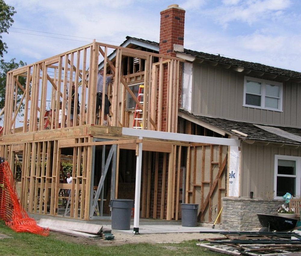 A home addition framed and tied into the roofline of the existing house.
