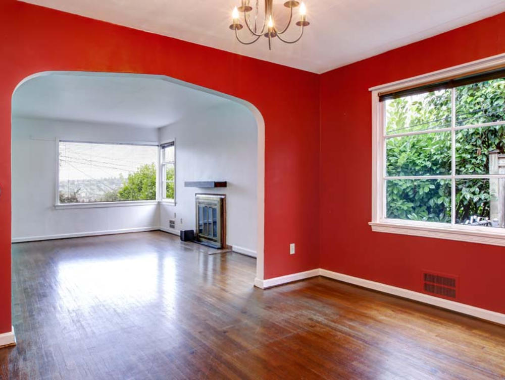 An interior painted with a bold red accent wall.